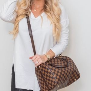 Brown checkered hand bag